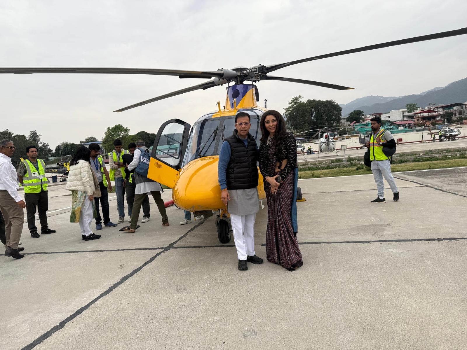 Helicopter on a mountain helipad with crew