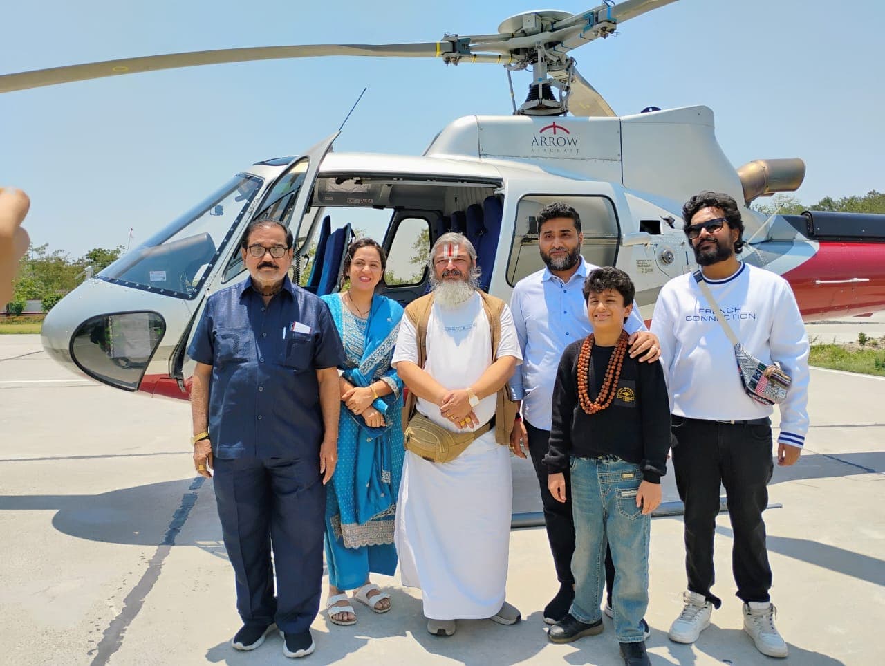 Guests inside a helicopter cabin with mountain views